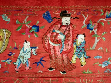 Chinese tapestry or banner, red silk with hand-embroidered figures around the border and one hundred characters hand-embroidered in the center with gold thread. The piece is canvas backed and has canvas loops along the top to allow for hanging.
