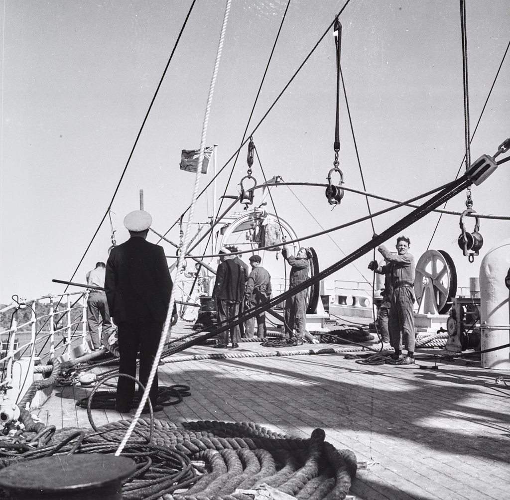 Deck scene showing cable line being prepared to lay on ocean floor.