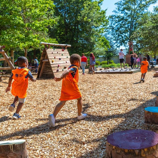 Children run and play in the Lil' Mariners' Play Zone.