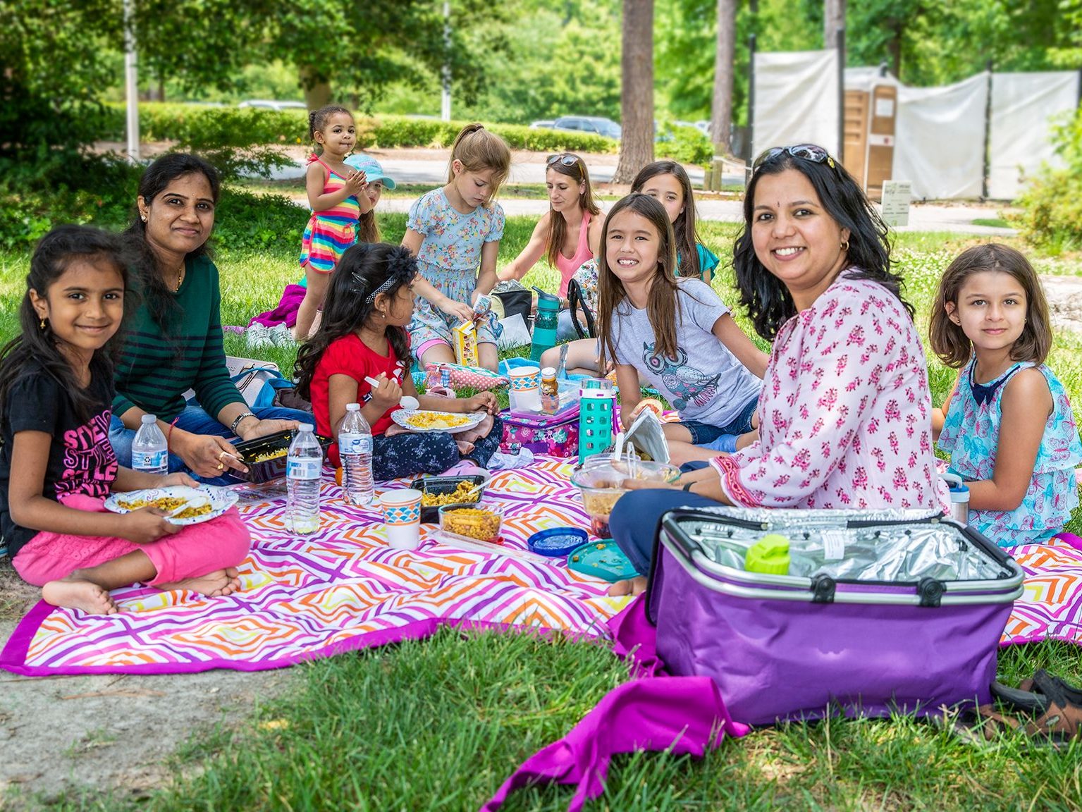 Large family enjoying a picnic.