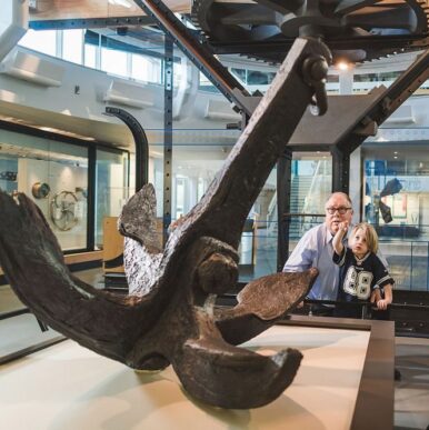 man & grandson pointing at an achor