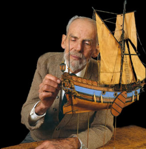 Man with small ship model