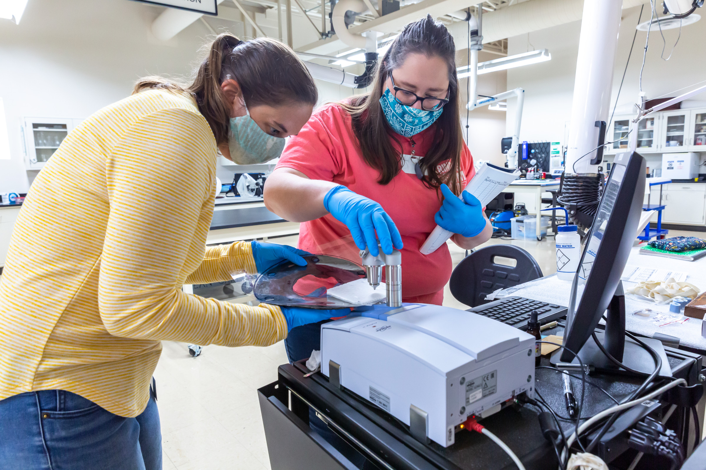 Lesley Haines, Archaeological Conservator, and Molly McGath, Research Scientist, are measuring a rubber gasket from USS Monitor using attenuated total reflectance-Fourier transform infrared spectroscopy (ATR-FTIR). The goal of this measurement is to learn more about the stability of the rubber material as it is dried for the first time since the sinking of Monitor.