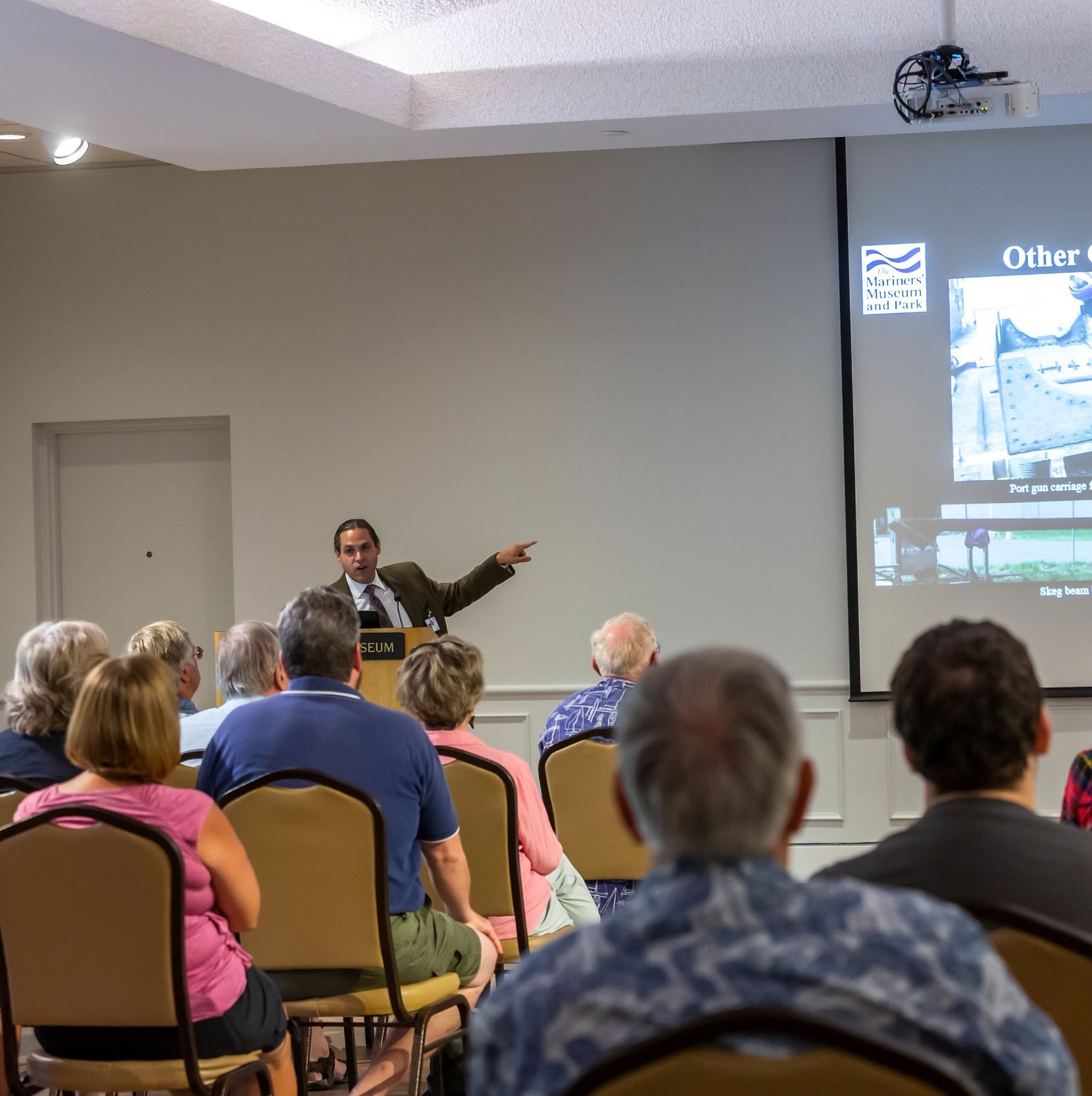 Group of senior adults attending a Speakers Bureau lecture at the Museum