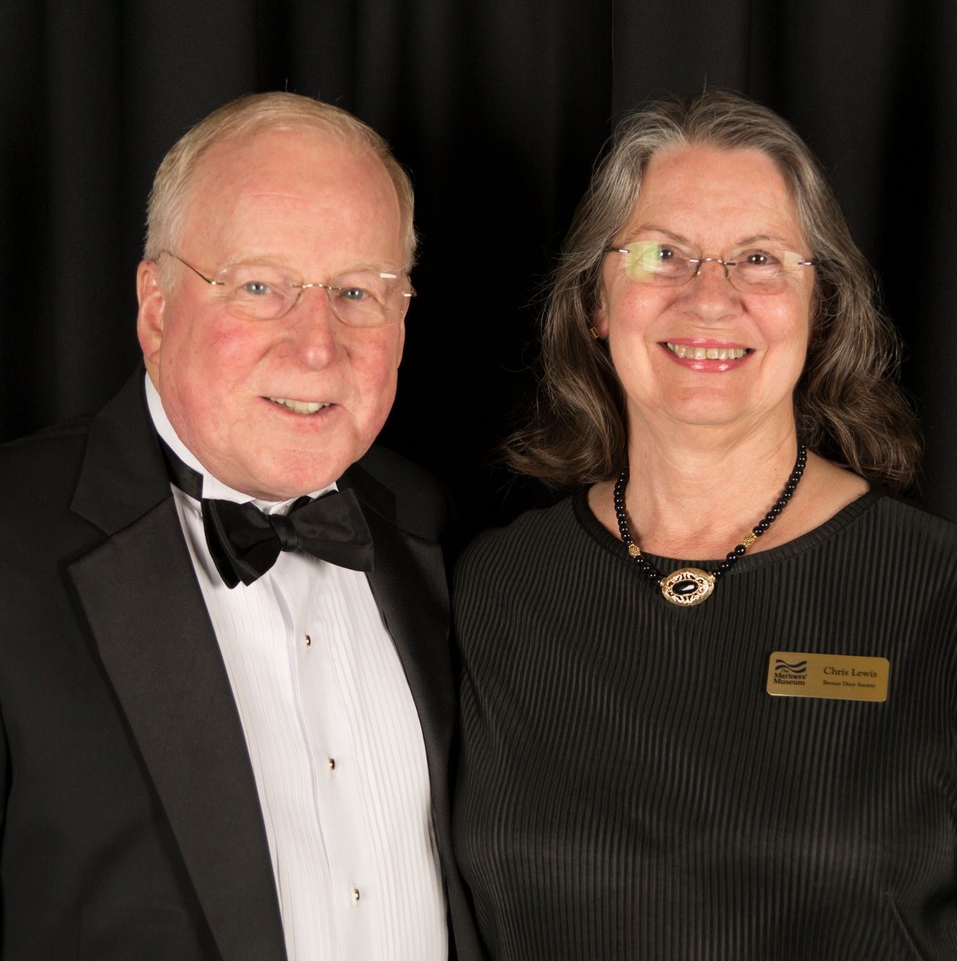 Headshot of Ron Lewis and his wife.