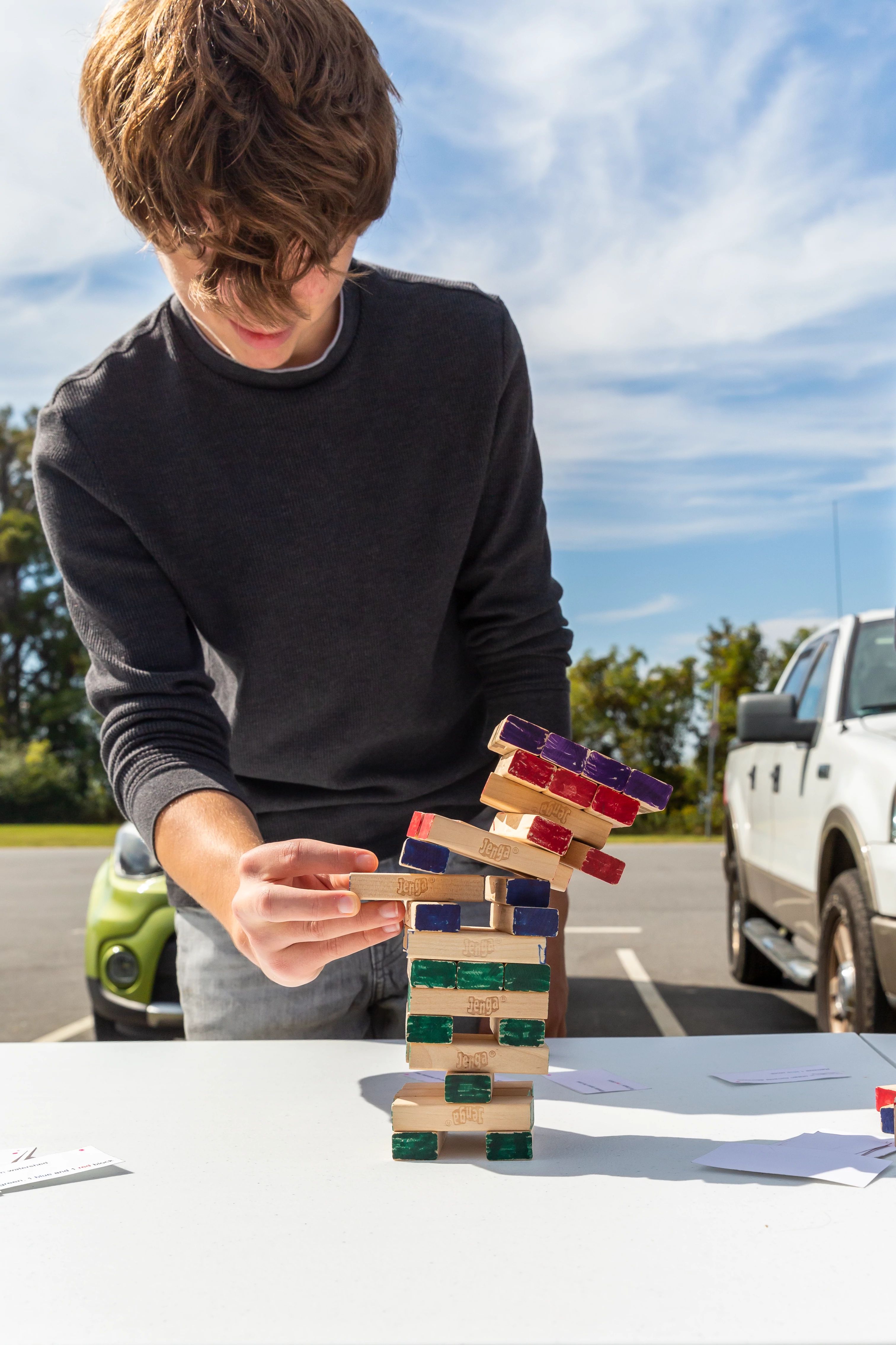 A Menchville High School student plays a trophic cascade Jenga game.