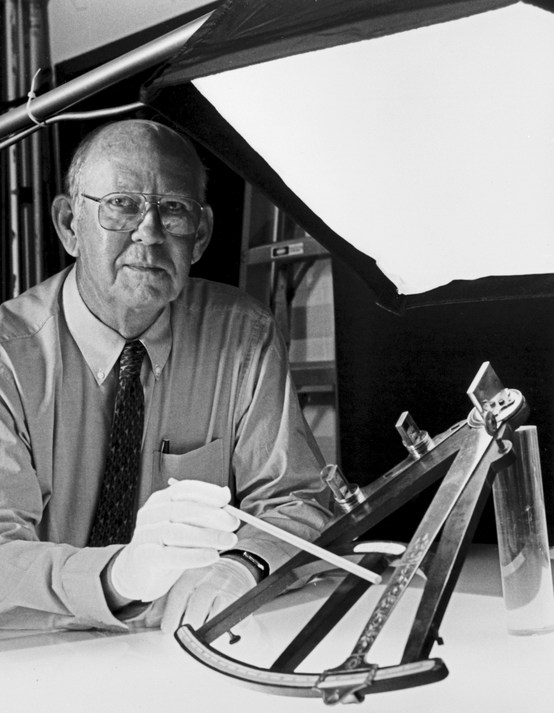 Dr. Paul W. “Peter” Ifland with an instrument from his collection.