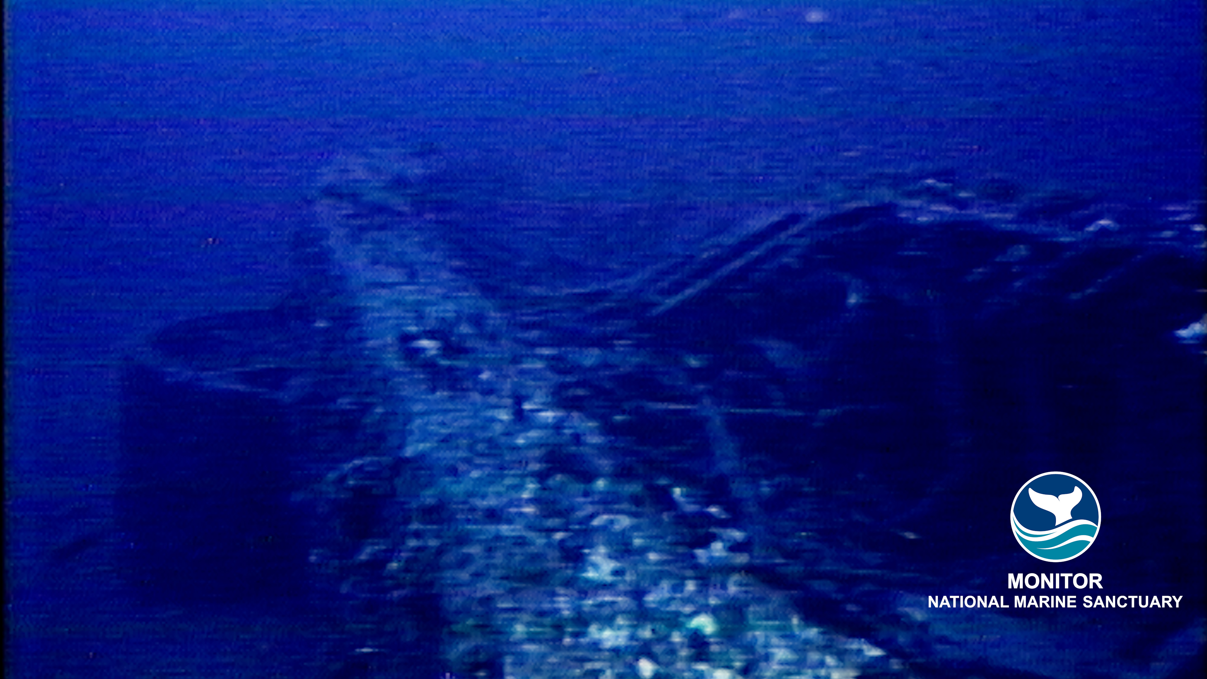 Underwater view of the Monitor National Marine Sanctuary, pre 2001. The Turret can be seen at the left under the edge of the ship.