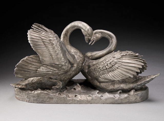 Sculpture of two swans.