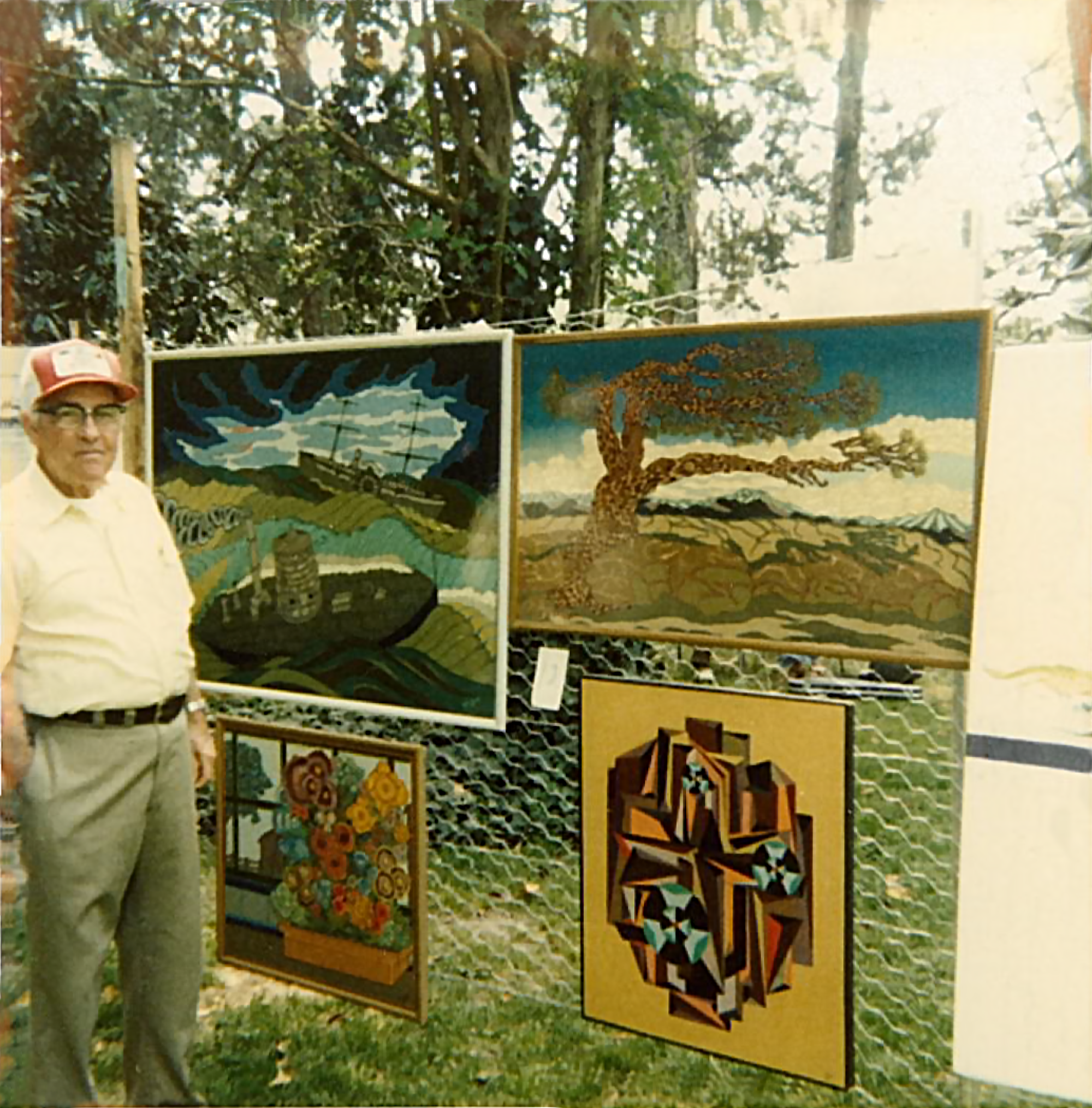 Robert T. Ewell with his paintings in Murfreesboro, North Carolina.
