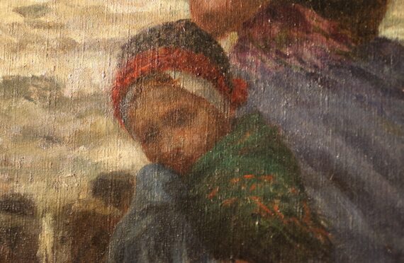 Detail of the child nestled against the woman beside her.