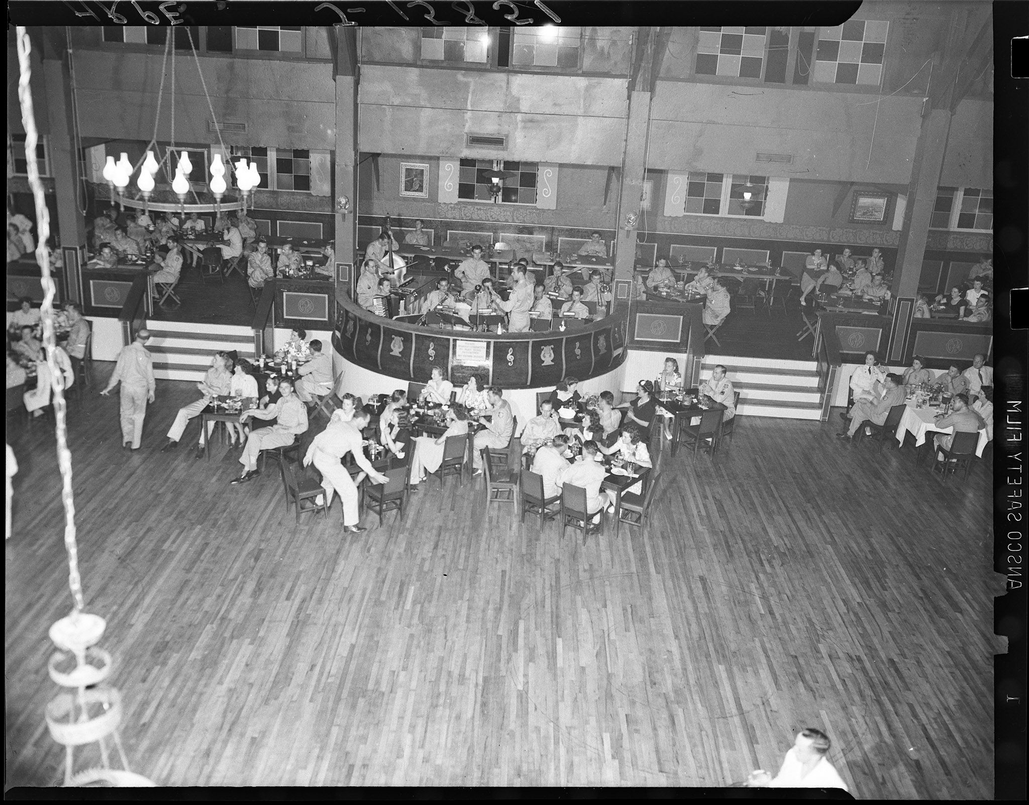 The band plays an upbeat tune for the audience as they make their way to the dance floor.