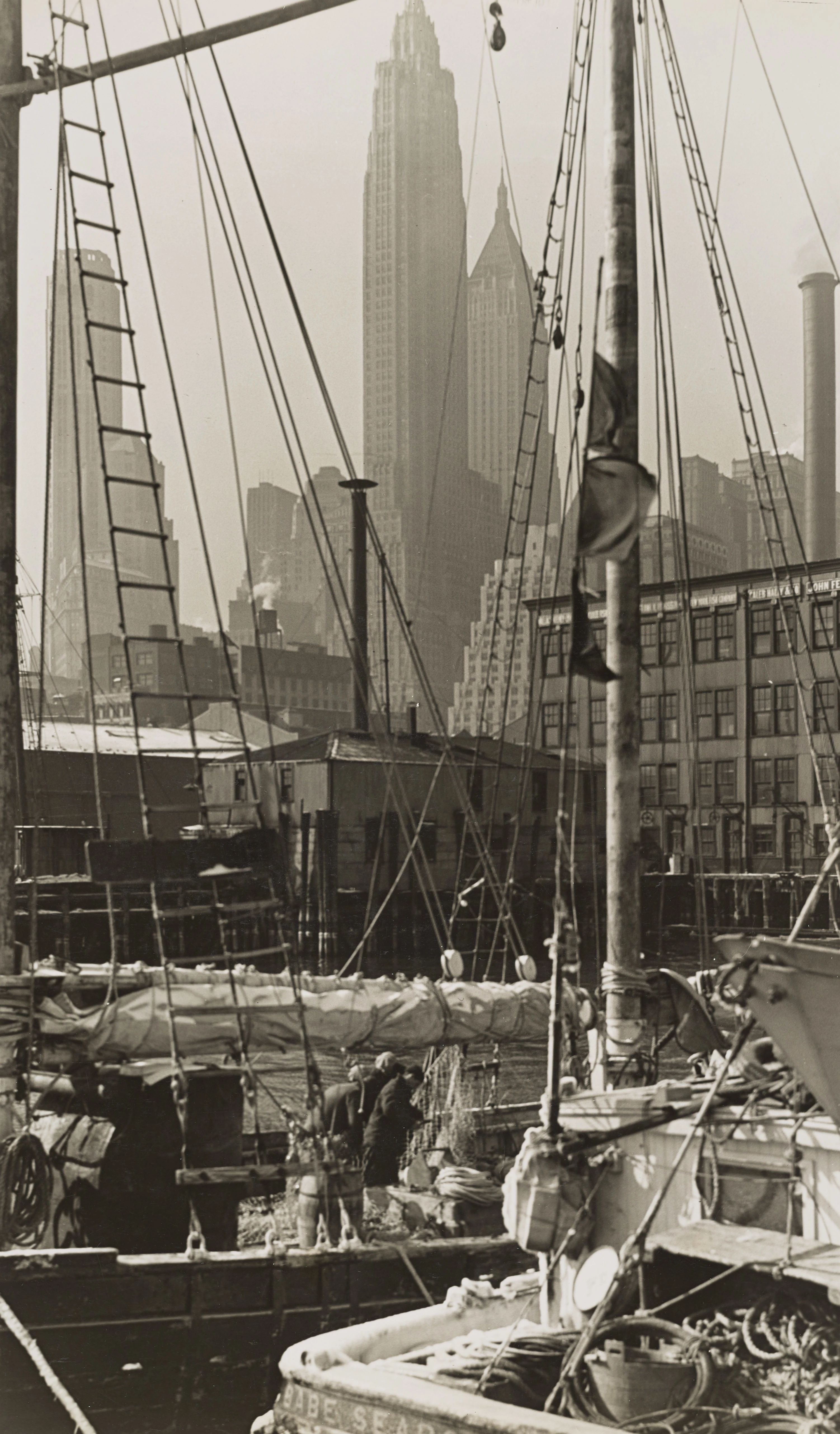 Boats tied to the dock near the Fulton Fish Market.