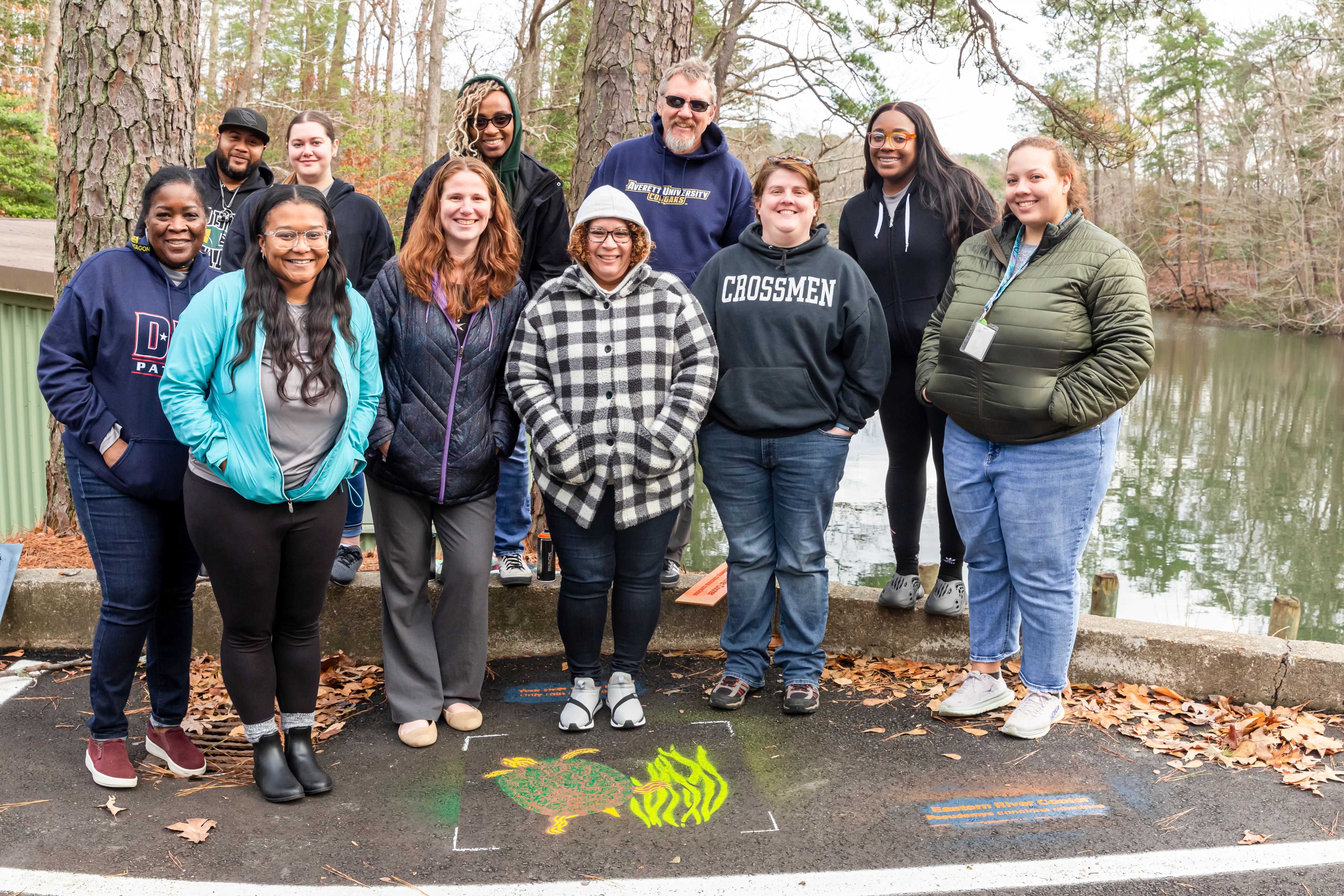 B-WET teachers work alongside The Mariners’ Education team at the Lake boathouse to "paint-out pollution" - a James River Association initiative that brings awareness to watershed health.