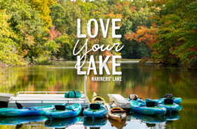 Kayaks in lake with text saying Love your Lake