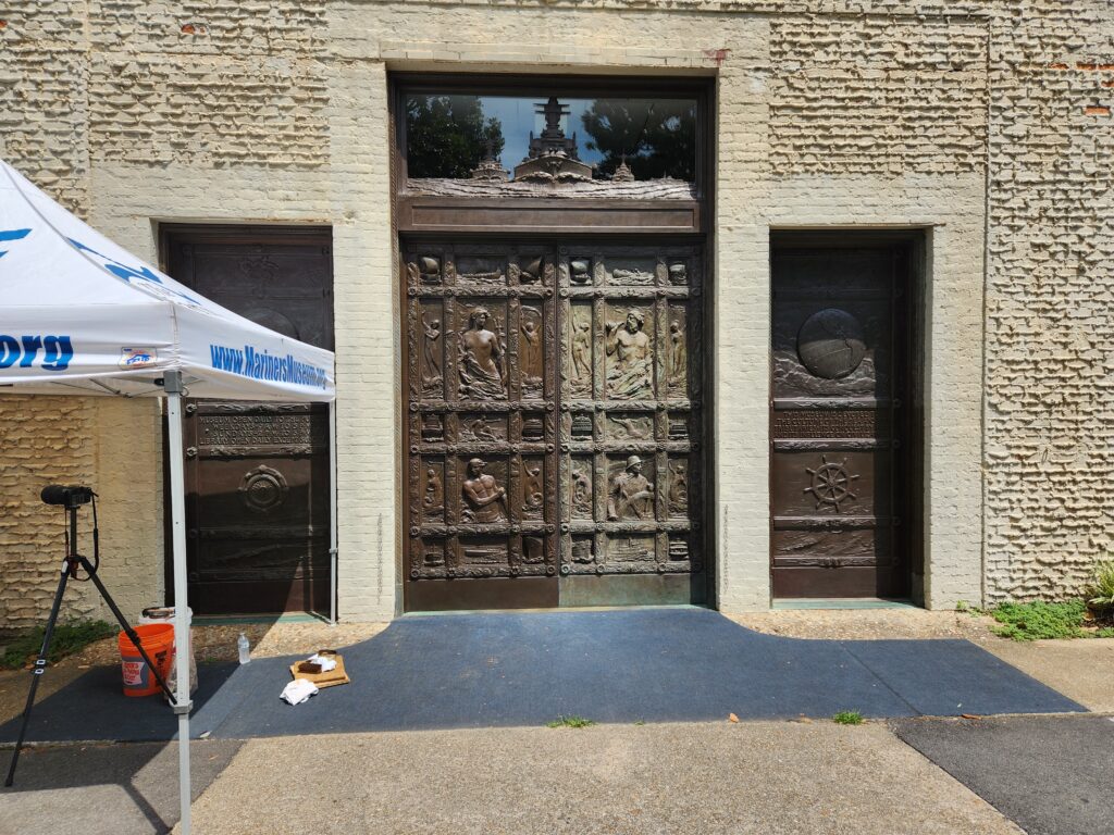 Image of the Bronze Doors half coated with wax.