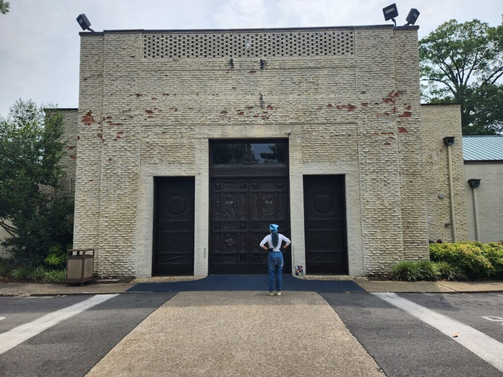 Image of Intern Marimar facing the Bronze Doors after finishing the treatment.