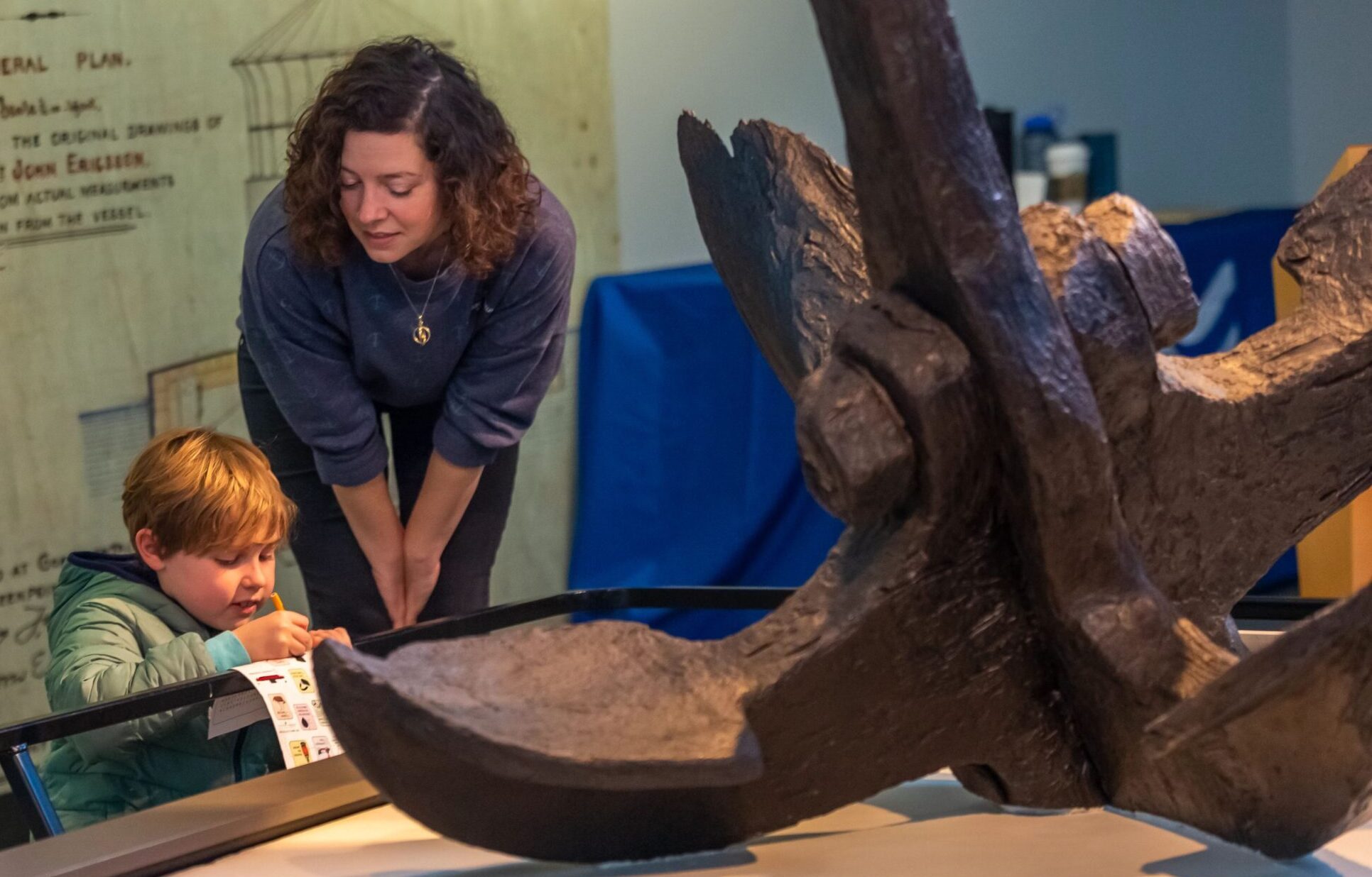 educator and child looking at monitor anchor.