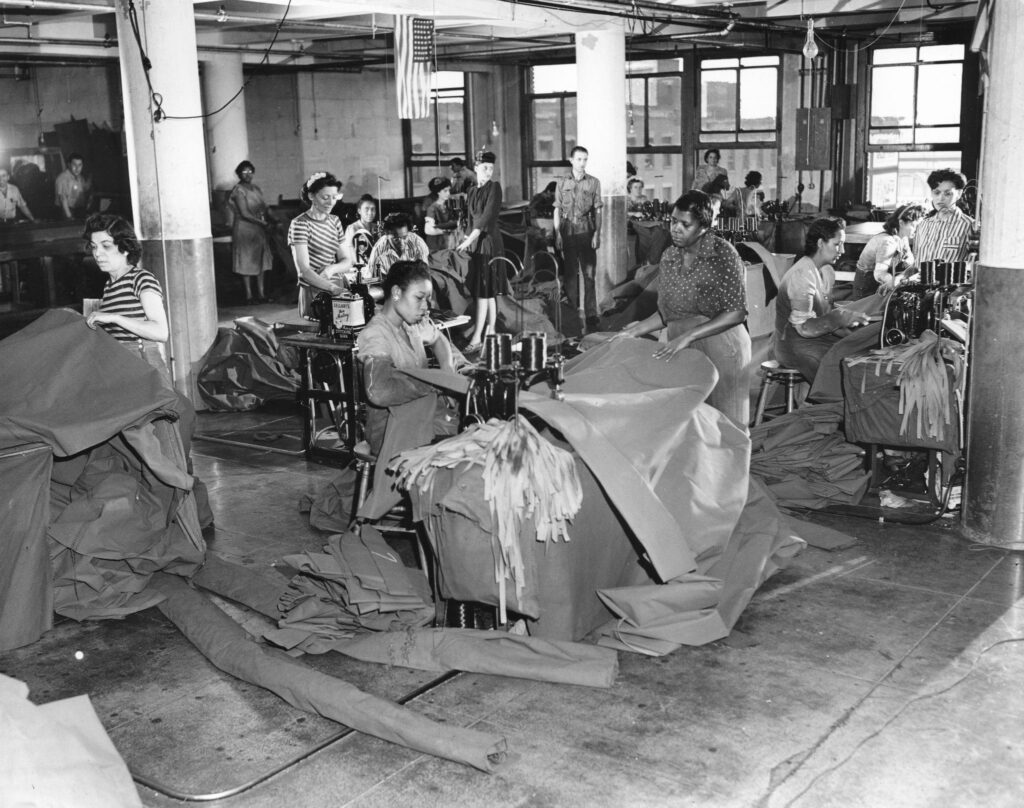 Women making sails on sewing machines
