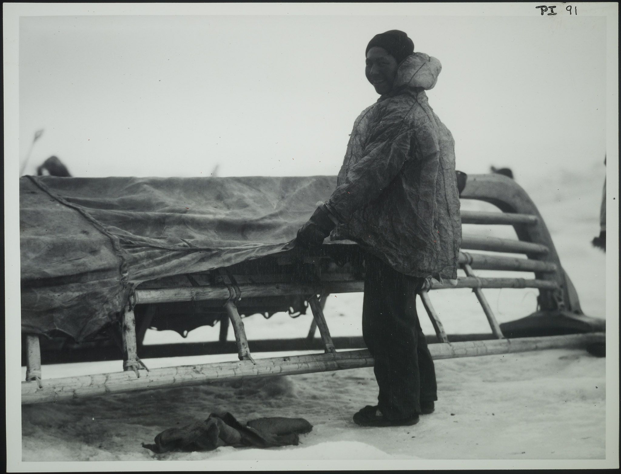 Close view of an Alaskan native covering umiak with skin