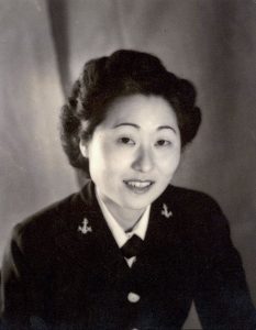 A black and white portrait of a woman of asian decent in a military uniform