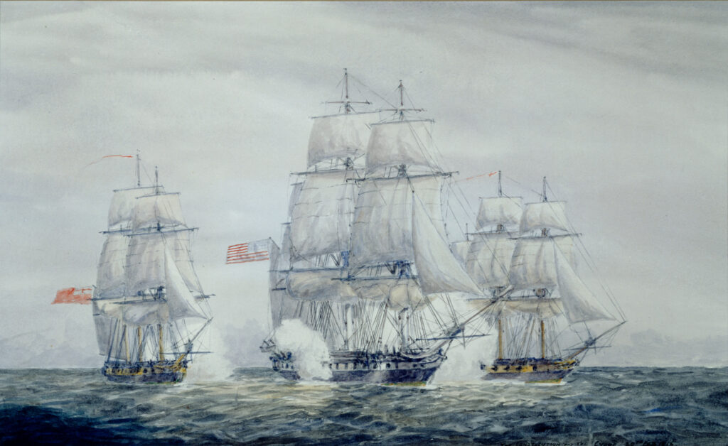 3 ships battle on the water.