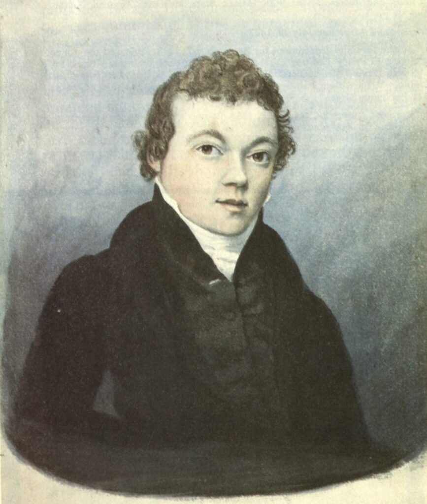 A portrait of a man in a suit.