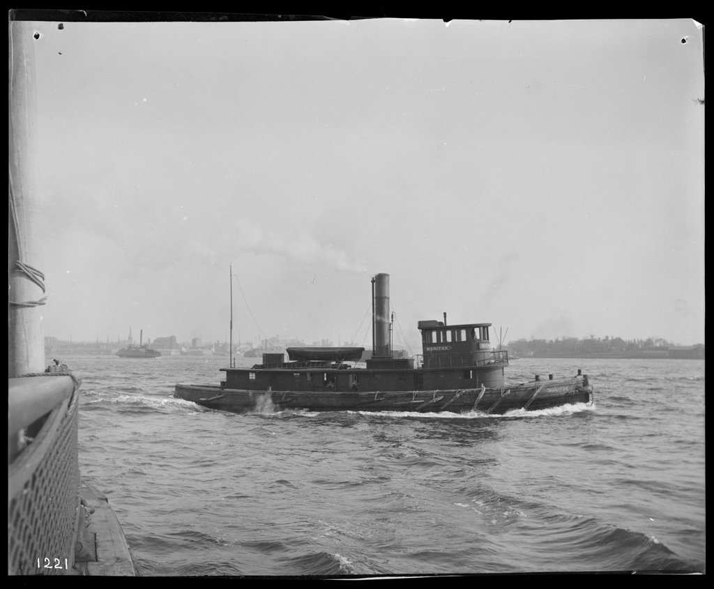 Black and white photograph of a tugboat in the water.