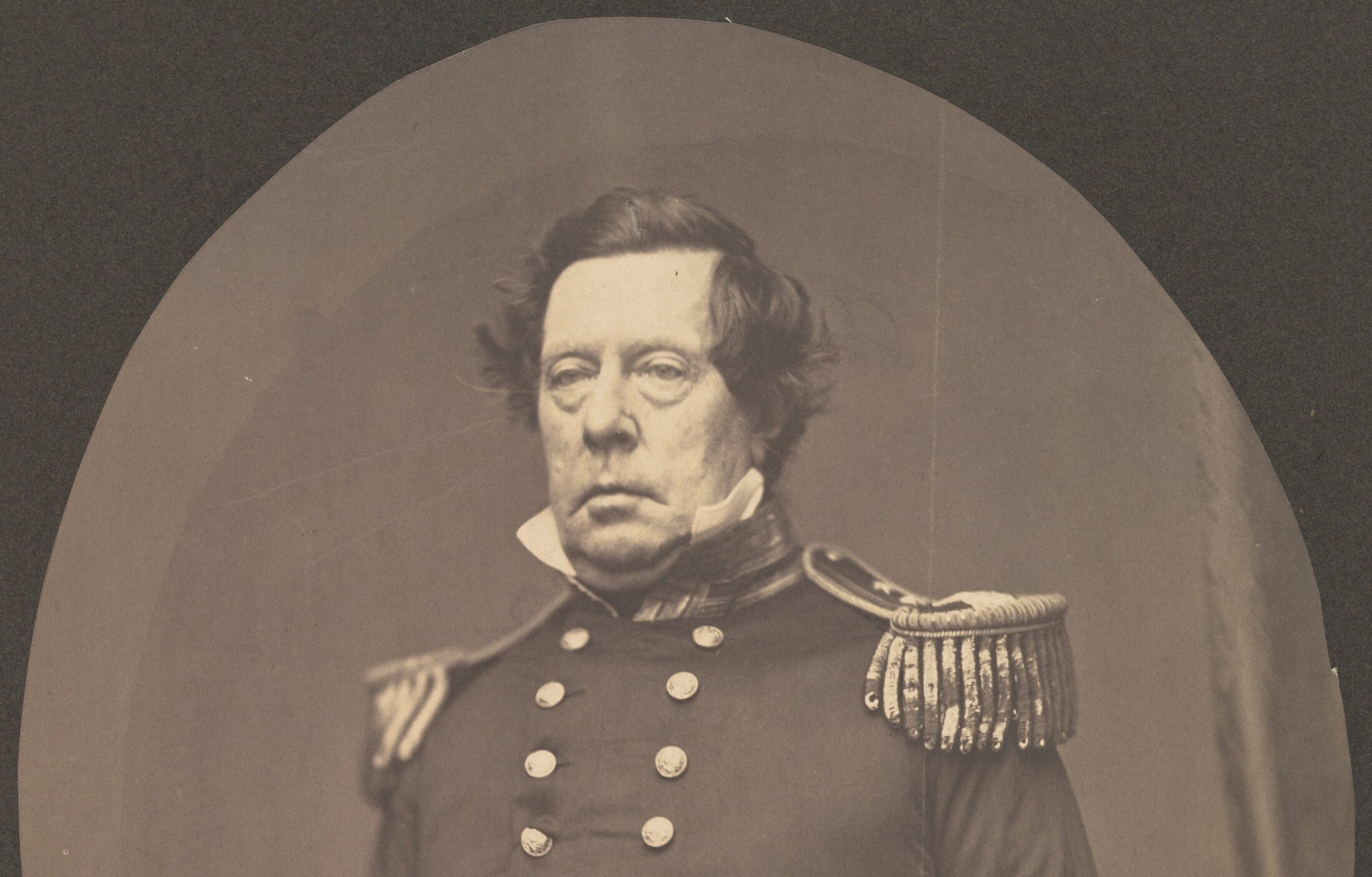 Black and white photograph of Matthew Perry.